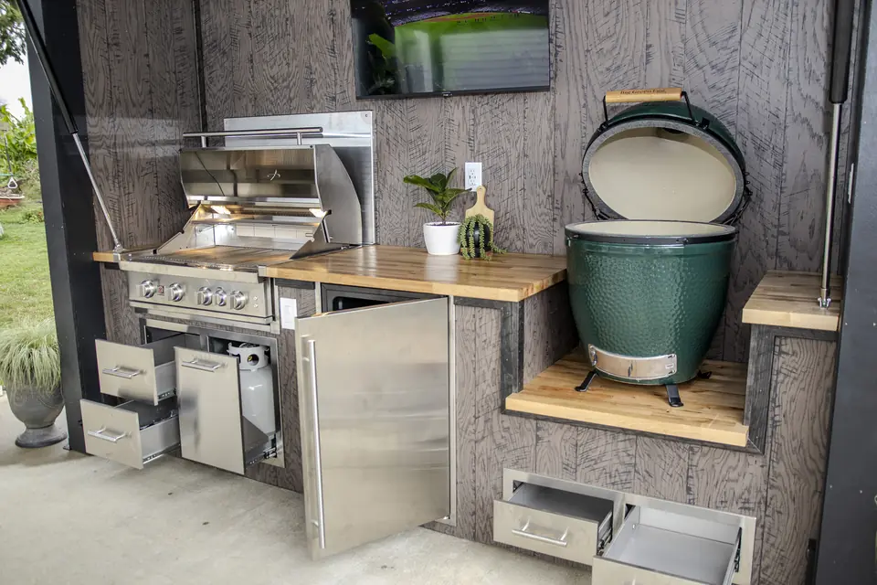 Inside a Flamehouse: gas grill, ceramic egg, butcher-block counters, fridge and storage