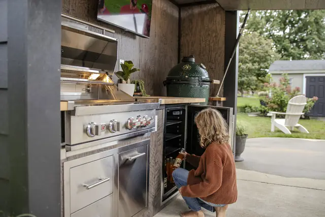 Grabbing a cold drink from the built-in fridge